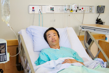 Ill Patient in hospital bed