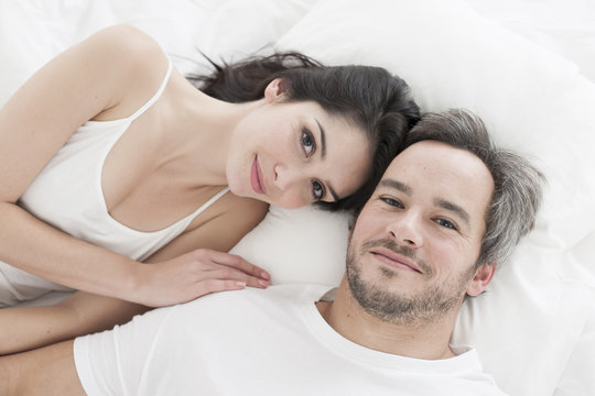 Lovely couple  lying in bed