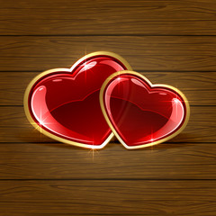 Two hearts on wooden background