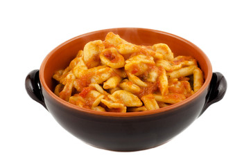 Tasty homemade orecchiette with tomato sauce
