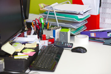 Close-up of real life messy desk in  office