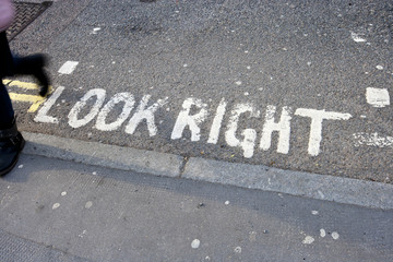 Close-Up of road marking saying Look Right in London, UK