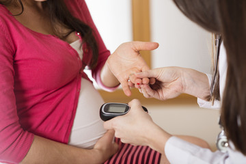 Pregnant woman with doctor