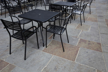 Tables and chairs at outdoor cafe