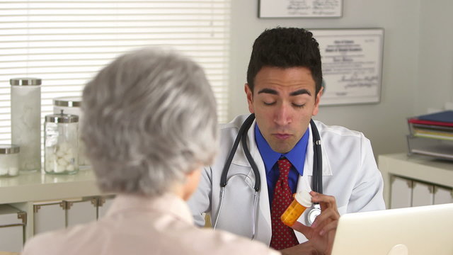 Hispanic doctor explaining prescription to patient