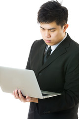 Asian businessman using laptop