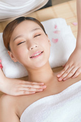 .A young woman enjoy massage.