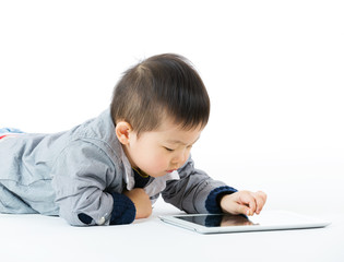 Asian little boy using tablet