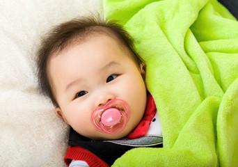 Asian baby with pacifier
