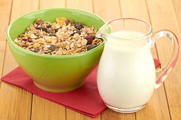Delicious and healthy cereal in bowl with milk