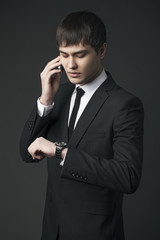 The  man is calling by mobile phone