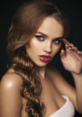 Beautiful girl with red lips. Red lipstick. Red manicure. long h