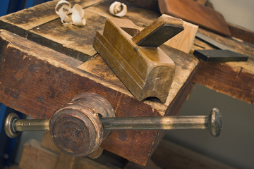 Old vise and tool in a workshop still-life