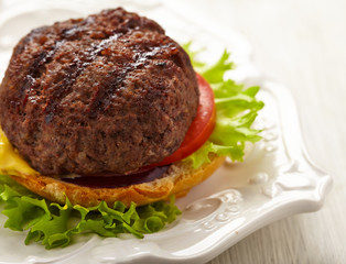 Homemade grilled hamburger on plate