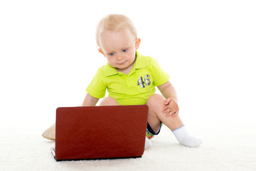 Baby boy with laptop.