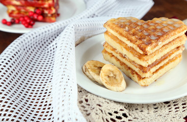 Sweet waffles on  plates. on wooden background