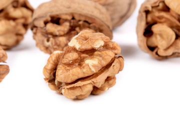 Bunch of walnuts whole and cracked.