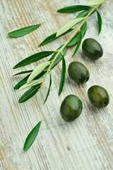 Olives over wooden background