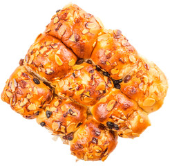 Homemade sweet bun with almond and raisins on a white plate