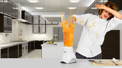 young female chef making an mess with a blender