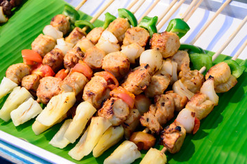 chicken barbecue stick on banana leaf in local market, Thailand