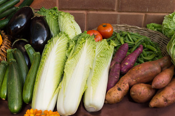 healthy Bio Vegetables on a clay brick Background