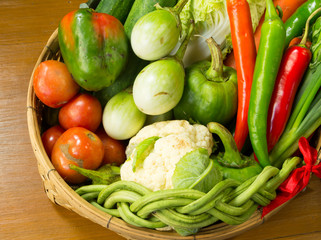 fresh vegetable in basket on wooden table