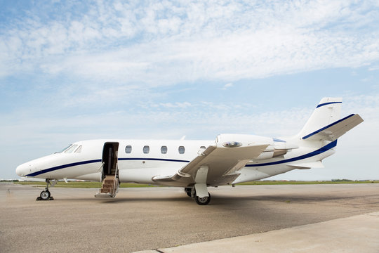 Fototapeta Private Jet Parked At Terminal