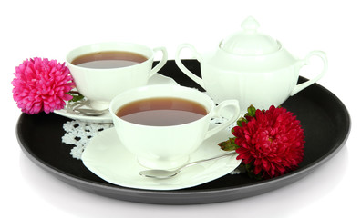 Obraz na płótnie Canvas Cups of tea on tray isolated on white