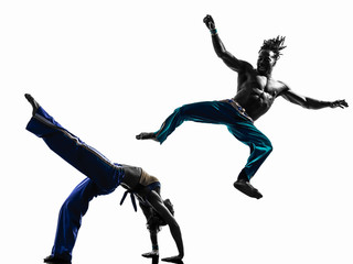 couple capoeira dancers dancing   silhouette