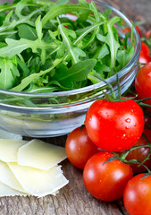 fresh salad from rucola, cherry tomatoes and parmesan cheese