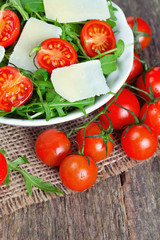fresh salad from rucola, cherry tomatoes and parmesan cheese