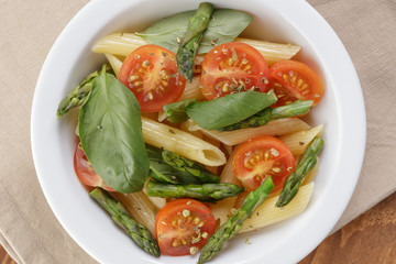 italian pasta penne with tomatoes and asparagus