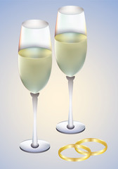 Wedding rings and champagne glasses