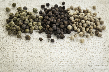 green, black and white peppercorns