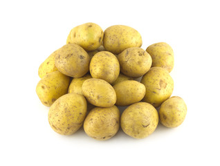 Heap of many ripe brown potatoes isolated close up