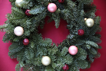 Fototapeta na wymiar ornaments and bells on fresh Christmas wreath