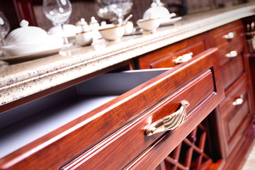 wooden cupboard with opened empty drawer