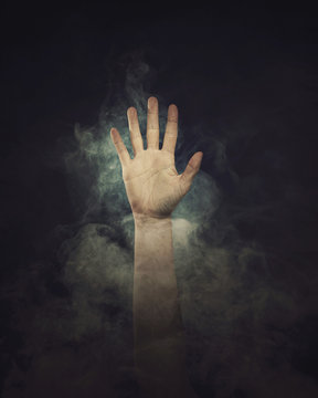 Hand in smoke