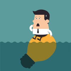 Young businessman with big light bulb underwater.