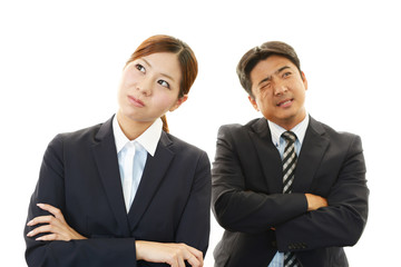 苦悩するビジネスマンとOL