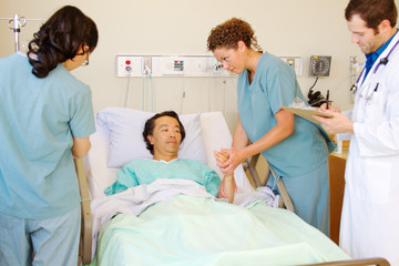 Nurse examing patients arm