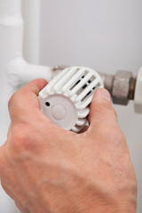 Fototapeta premium Plumber Fixing Thermostat