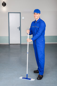 Worker Cleaning Floor