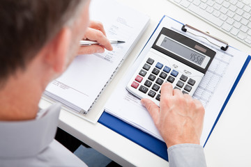 Businessman Calculating Finance