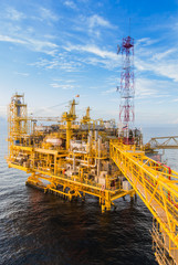 Oil platform yellow color in the sea