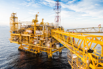 Oil platform yellow color in the sea