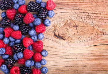 Berries on Wooden Background. Raspberries, Blueberry