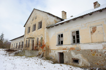 Abandoned ruined building on a background of winter
