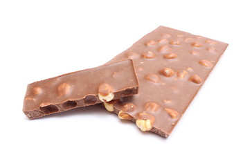 Portion of chocolate with nuts on white background
